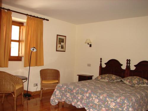 Cama ou camas em um quarto em Apartamentos LAZKANO I Y II