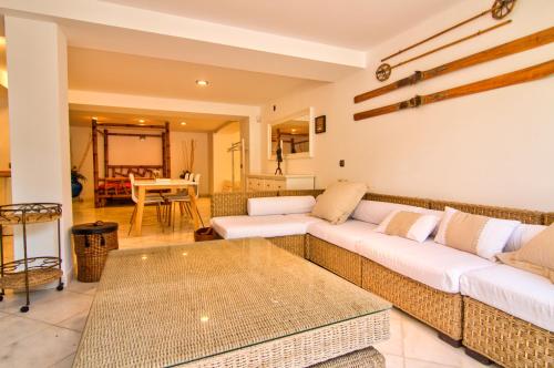 a living room with a couch and a table at Altair 11 in El Puerto de Santa María
