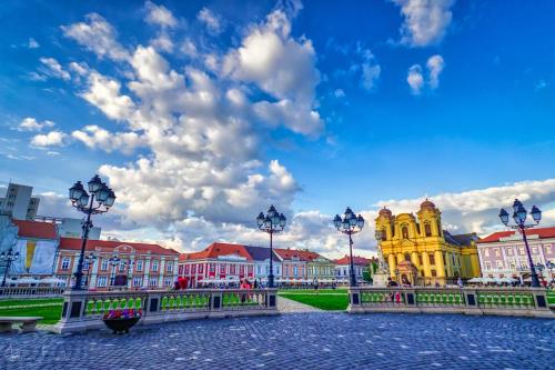 a view of a city with buildings and street lights at Take PRO Timisoara Apartment in Timişoara