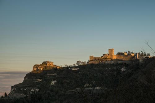 a castle on the top of a mountain at Una Casa al Belvedere in Enna