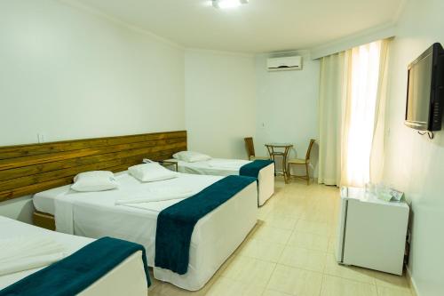 Ένα ή περισσότερα κρεβάτια σε δωμάτιο στο Caldas Park & Hotel Caldas Novas