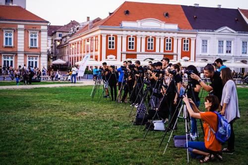 a group of people taking pictures in front of cameras at Take PRO Timisoara Apartment in Timişoara