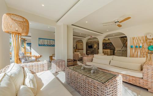 a living room filled with furniture and decor at Seastar Hotel in Flic-en-Flac