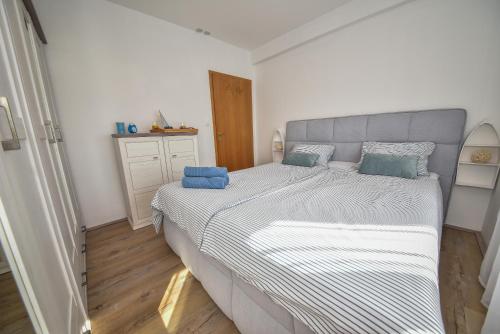 Postel nebo postele na pokoji v ubytování Apartmani Rudius