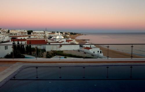 a view of the beach from the roof of a building at Vila Sao Vicente Boutique (Adults Only) in Albufeira