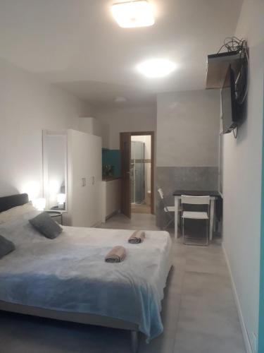 a bedroom with a large bed and a table at Sol De Sopot in Sopot