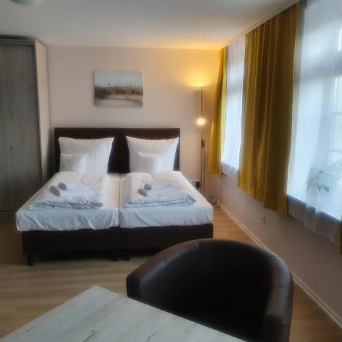 Ένα ή περισσότερα κρεβάτια σε δωμάτιο στο Apartments Oberschlesien