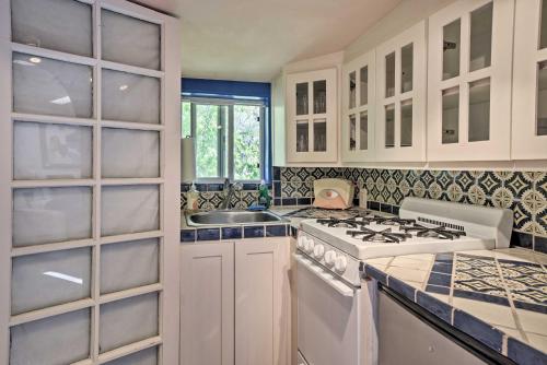 a kitchen with a stove and a sink at Charming Casita Studio - Near Santa Fe Plaza! in Santa Fe