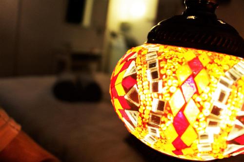 a close up of a stained glass lamp on a table at H Juan in Marbella