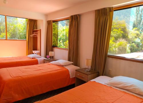 Postel nebo postele na pokoji v ubytování Tambo de Ollantay Hotel