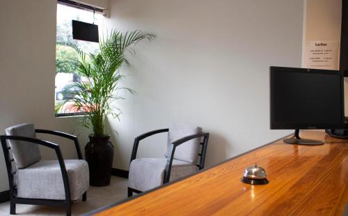 TV a/nebo společenská místnost v ubytování Hotel Winn Comfort