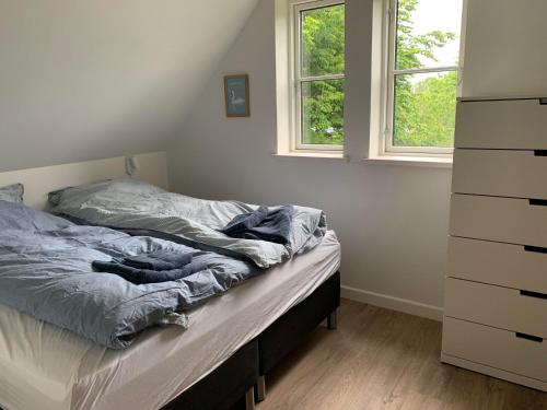 Кровать или кровати в номере Langø Feriecenter - Garden View