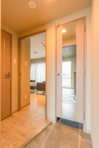 a hallway with sliding glass doors in a house at VILLA KOSHIDO KOTONI annex in Sapporo