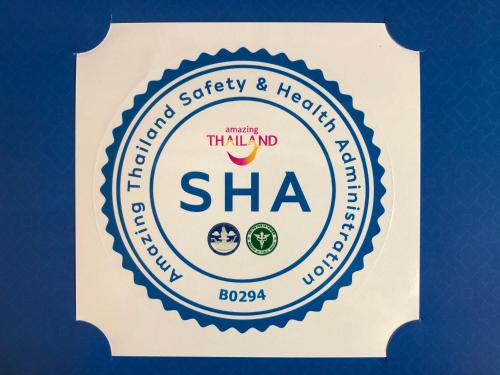 a sign for the traband sharmaarmaarma dispensary and health clinic at Chu Hotel in Chiang Mai