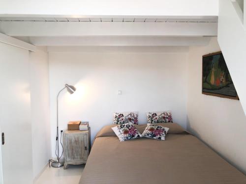 a bedroom with a bed with two pillows on it at La Casetta in Galaxidi