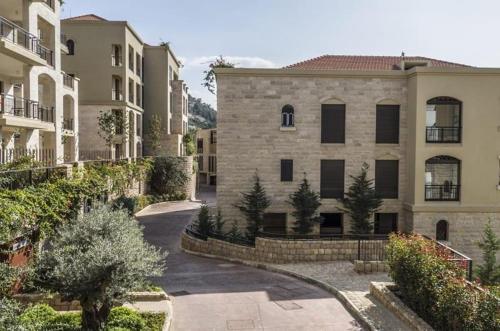 an apartment complex with a courtyard with a building at Beit Misk in Beirut