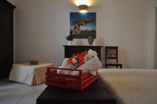 a bedroom with a bed and a painting on the wall at B&B Villa Rosanna in Fasano