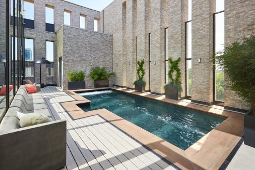 a swimming pool in the middle of a building at Van der Valk Hotel Amsterdam - Amstel in Amsterdam