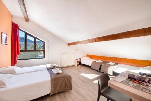 Una cama o camas en una habitación de Village vacances Chalet de la Haute-Joux