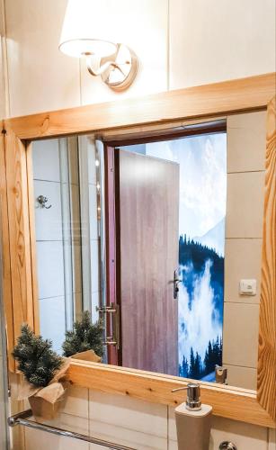 a bathroom window with a view of a mountain at Zakopane Stop in Zakopane