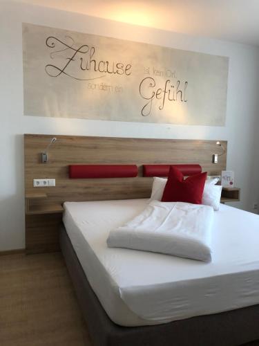 Ένα ή περισσότερα κρεβάτια σε δωμάτιο στο Hotel Asgard