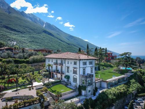 a large house with a view of the ocean at Bellevue San Lorenzo (Adults Only) in Malcesine
