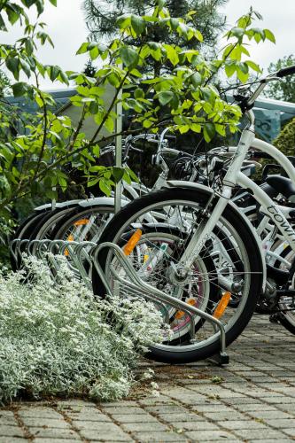a row of bikes parked next to each other at Roze Boutique Apartments in Liepāja