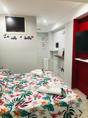 a bedroom with a bed with two pillows on it at Scilla's Dream in Scilla