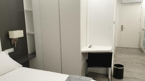Katil atau katil-katil dalam bilik di Apartaments y Habitacions Entre Volcans