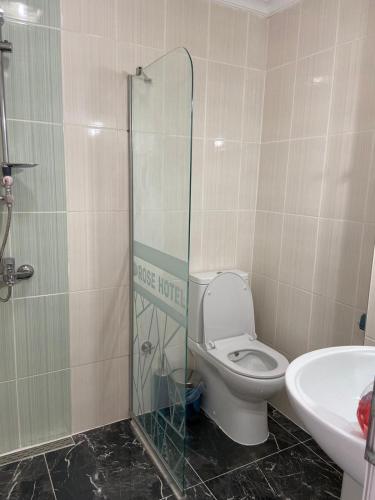 a bathroom with a toilet and a sink at Rose Hotel B&B in Patara