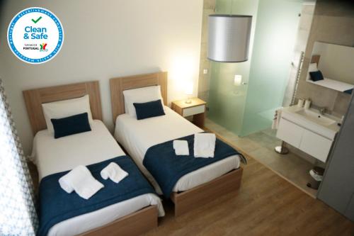 Ένα ή περισσότερα κρεβάτια σε δωμάτιο στο Coudelaria Residence