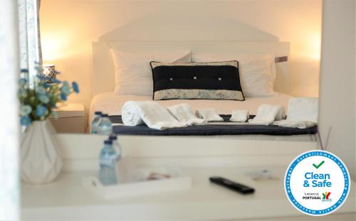 Ένα ή περισσότερα κρεβάτια σε δωμάτιο στο Coudelaria Residence
