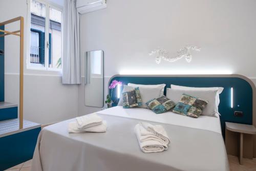 Postel nebo postele na pokoji v ubytování Hotel Grifo