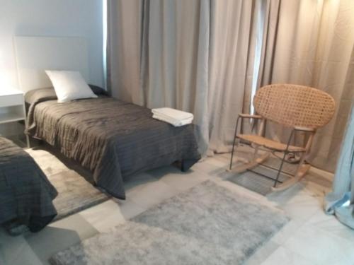 Ein Bett oder Betten in einem Zimmer der Unterkunft Marbella House Penthouse 85