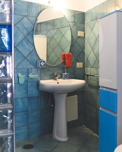 a bathroom with a sink and a mirror at Parco Augusto in Capri