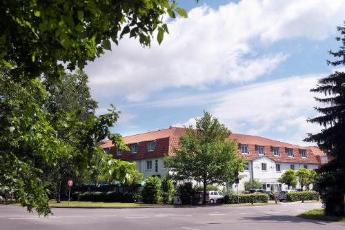 a street in front of a building at Wyndham Garden Potsdam in Potsdam