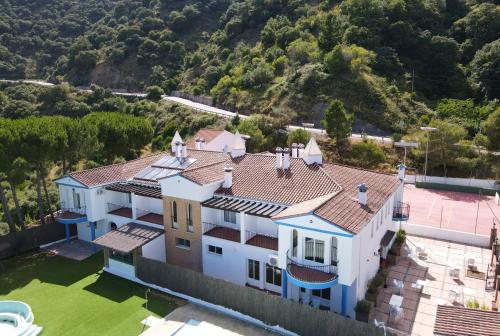 an aerial view of a house with a roof at Hotel La Fuentecilla in Algatocín