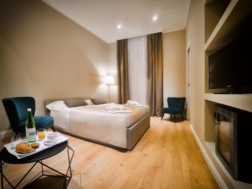 Postel nebo postele na pokoji v ubytování Hotel Touring Wellness & Beauty