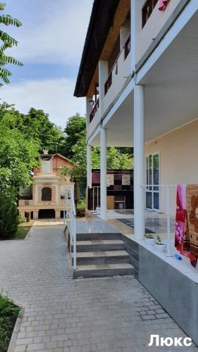 a house with a staircase leading to a building at Вапнярка, Одесская область, жилье у моря in Vapnyarka