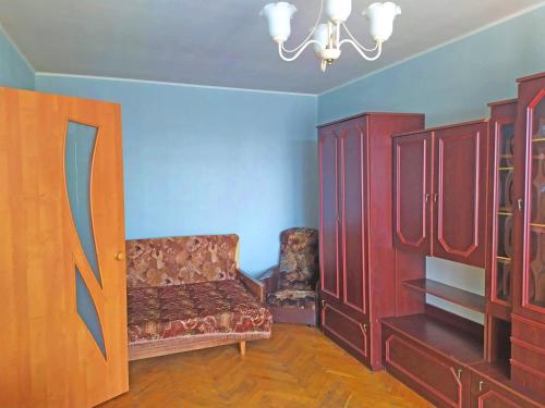 a living room with a couch and some cupboards at Malishko in Kyiv