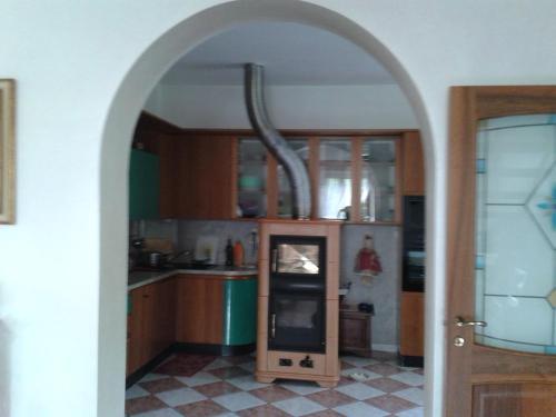 an archway in a kitchen with an oven in it at B&B bread and fantasy in Ostra