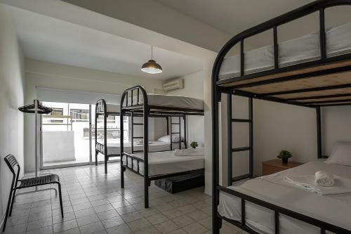 Postel nebo postele na pokoji v ubytování White Hostel