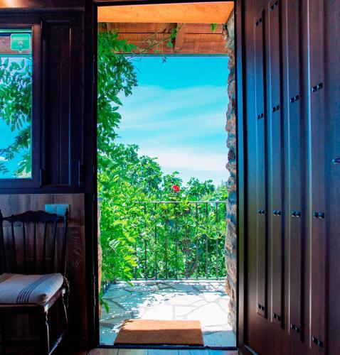 an open door to a porch with a view at Rural Médulas Viviendas de uso turistico 2 y Casas rurales 2 in Las Médulas
