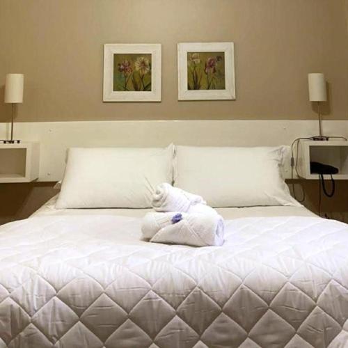 Katil atau katil-katil dalam bilik di Verona Parque Hotel
