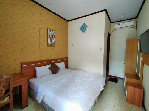 Katil atau katil-katil dalam bilik di Grand Mutiara Hotel Puncak