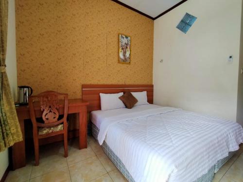Katil atau katil-katil dalam bilik di Grand Mutiara Hotel Puncak