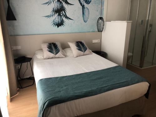 Postel nebo postele na pokoji v ubytování Hotel Torá