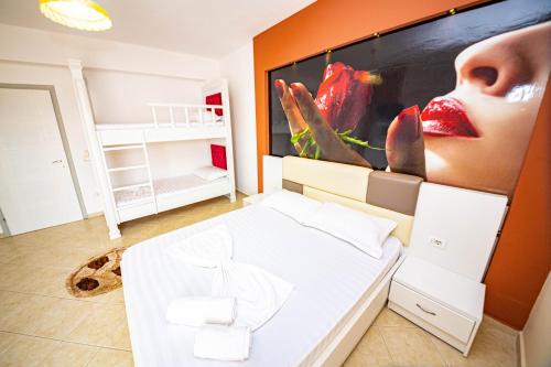 Postel nebo postele na pokoji v ubytování Ideal ApartHotel Saranda
