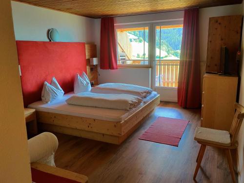 מיטה או מיטות בחדר ב-Schlossberg