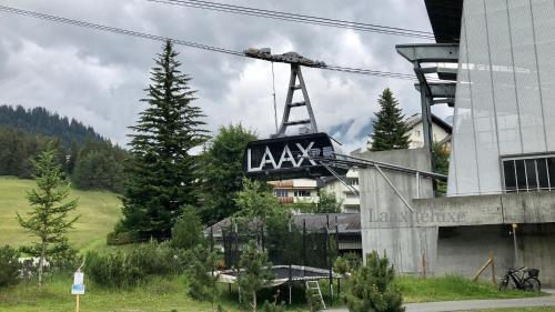 a sign on the side of a building at Rancho Laaxdeluxe in Laax